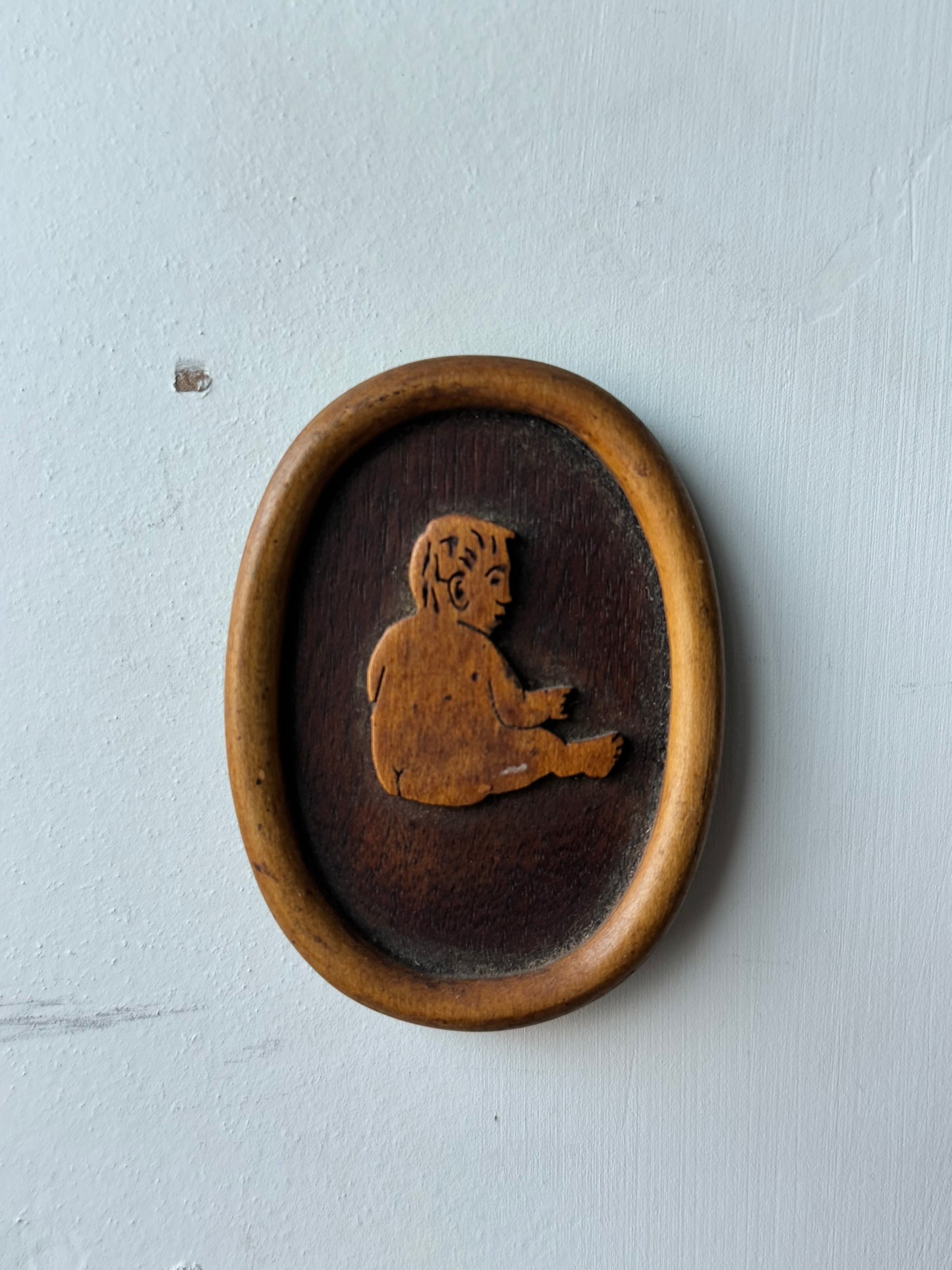Wooden Carving of a Baby