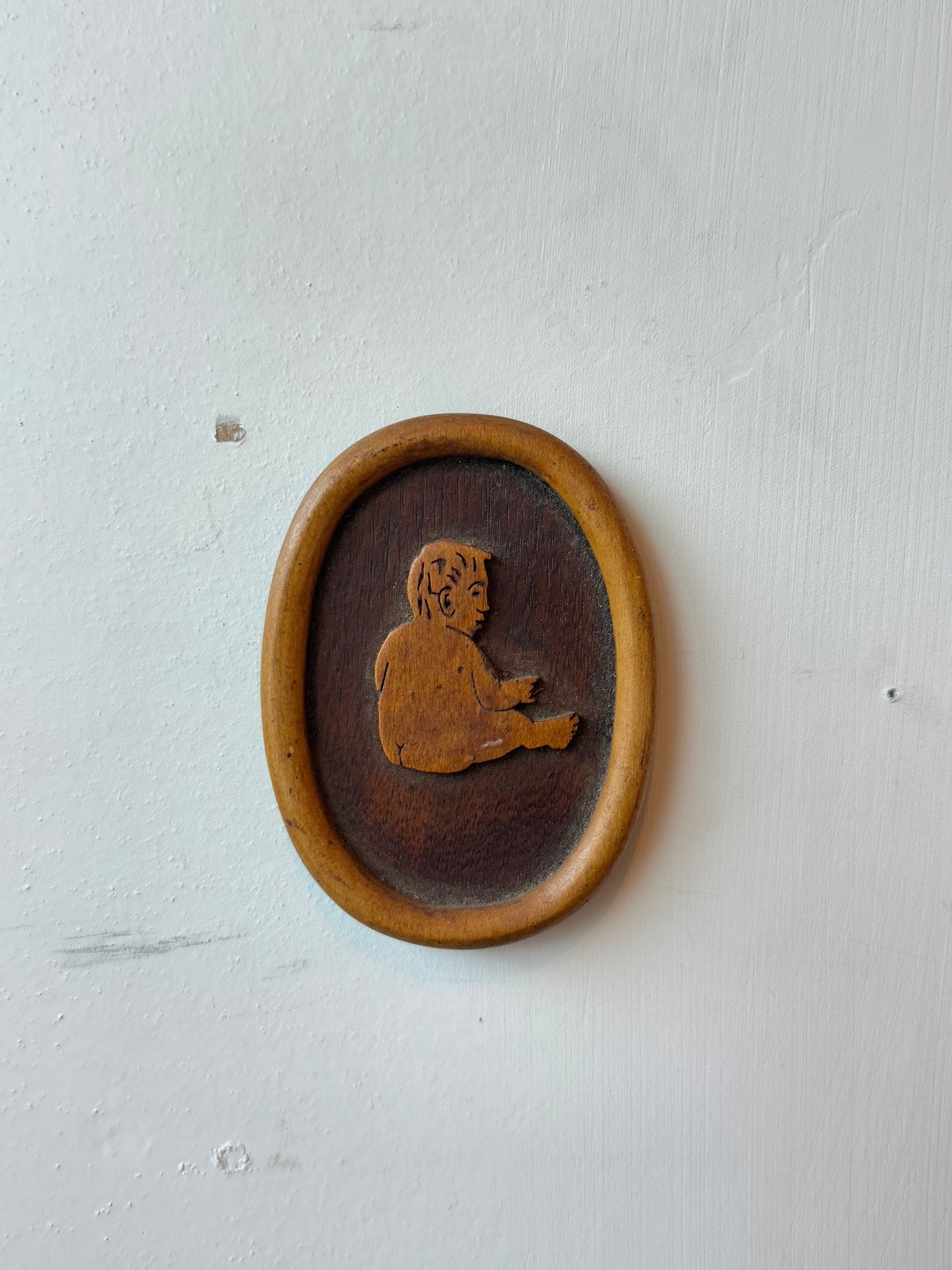 Wooden Carving of a Baby