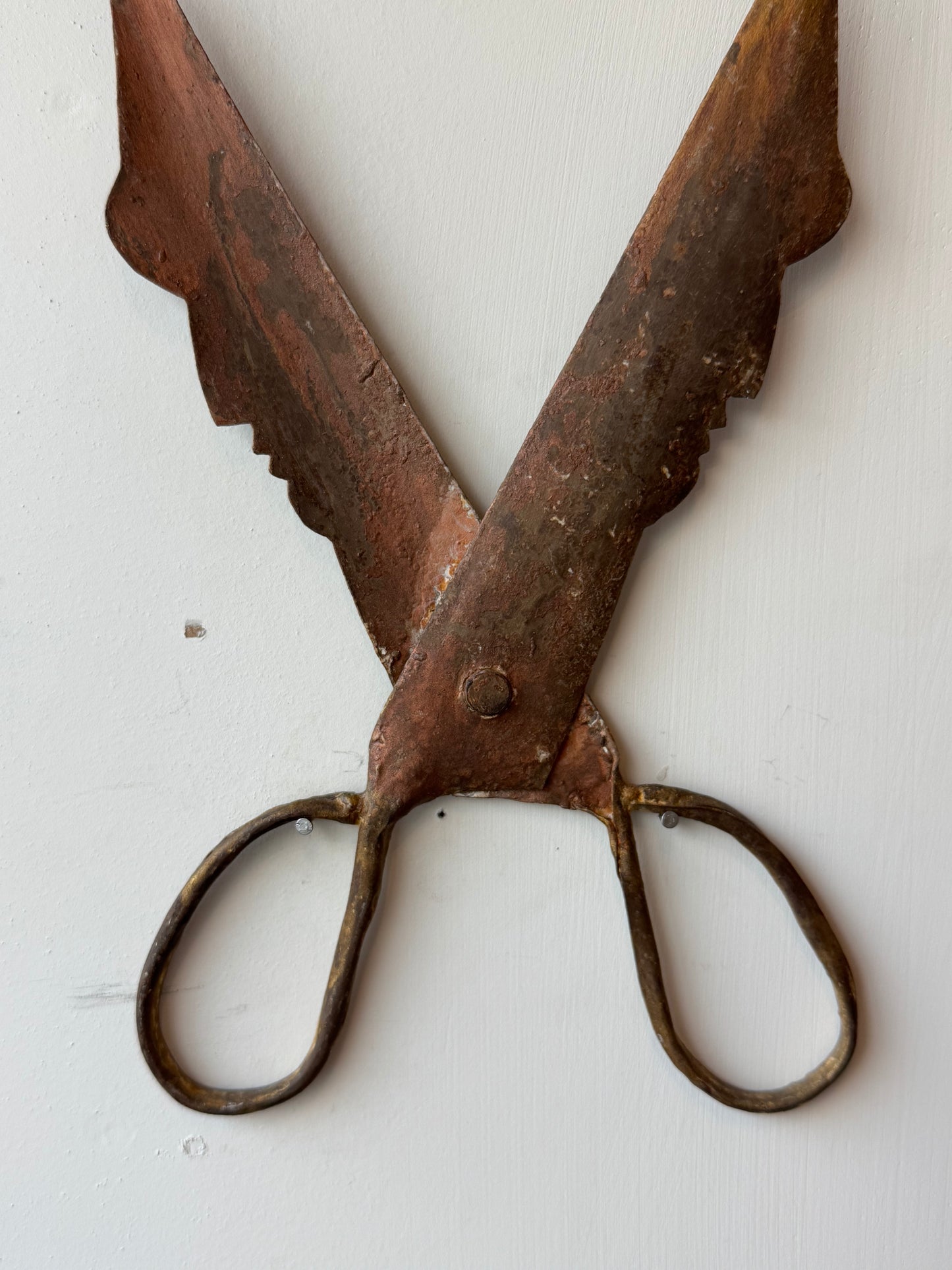 Barbers signage in the shape of two faces