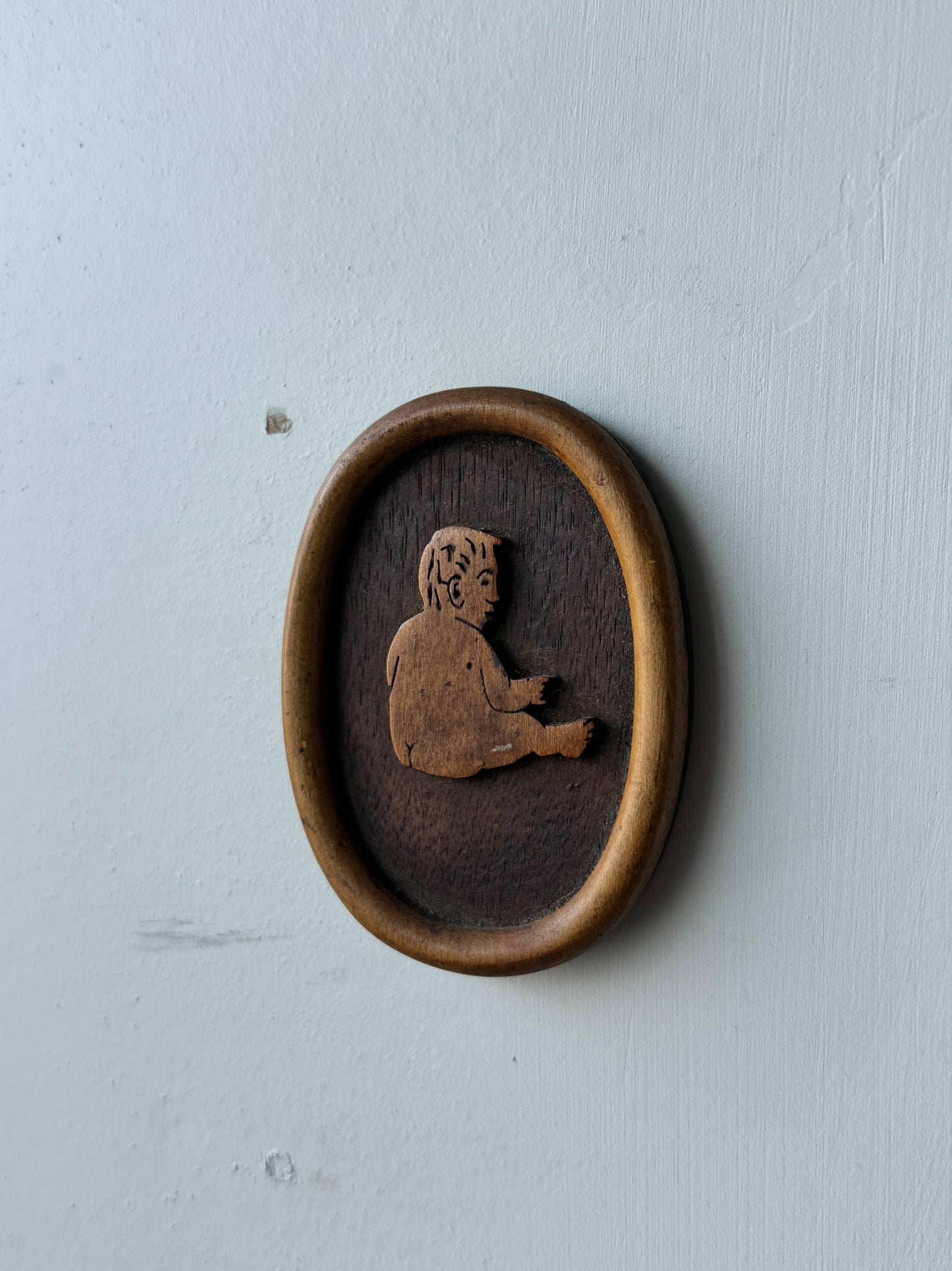 Wooden Carving of a Baby